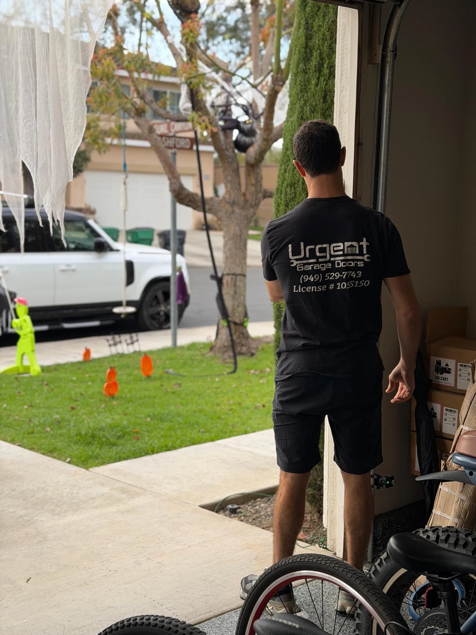Urgent Garage Doors technician performing emergency garage door repair in Orange County